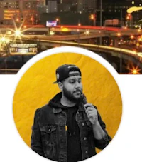 a man is holding a microphone in front of a city